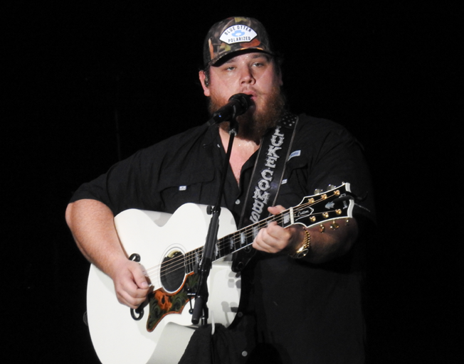 Luke Combs on stage at Grossinger Motors Arena in Bloomington, IL