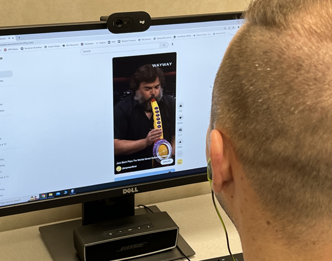 A guy watching a YouTube video at work