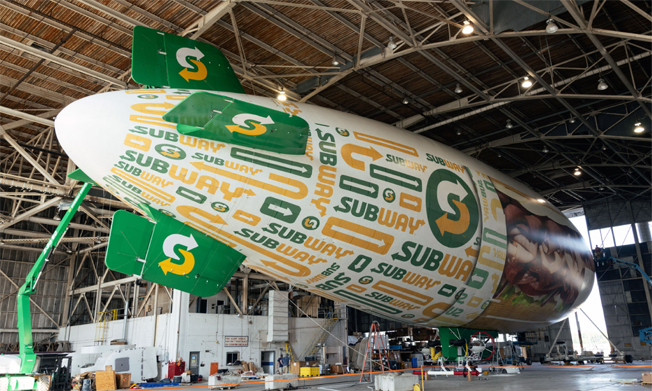 Subway blimp being prepared in hanger