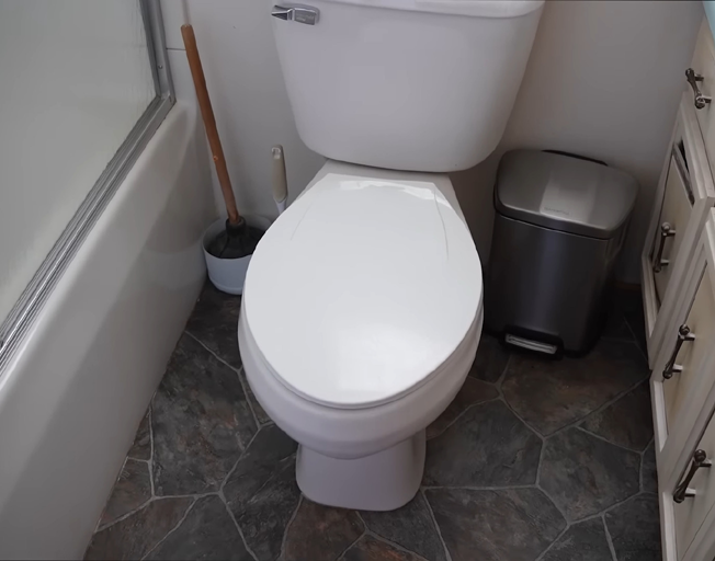 A toilet in a bathroom