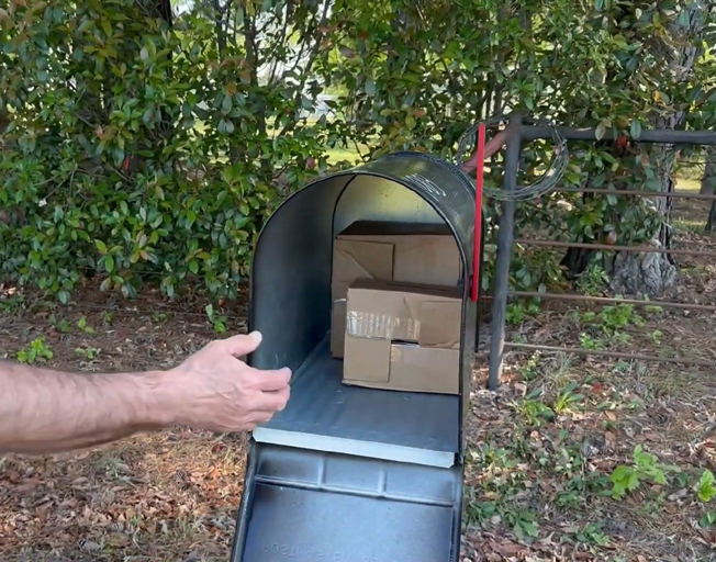 A large mail box with 2 boxes inside