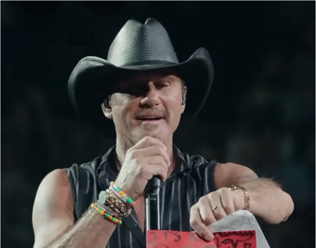 Tim McGraw on stage helping with gender reveal