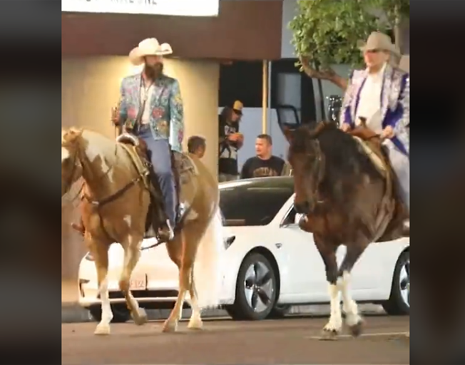 Post Malone and Dwight Yoakum riding horses on Sunset Boulevard