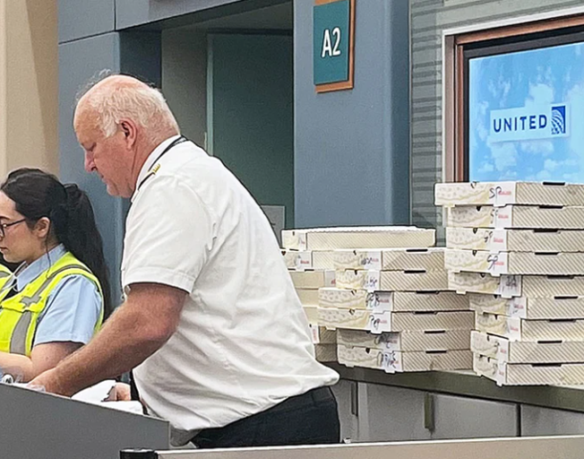 After an emergency landing, a pilot throws a pizza party at gate for stranded passengers