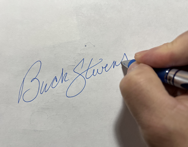 Buck Stevens signing his name